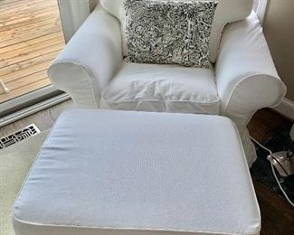 IKEA slipcovered rolled arm chair and storage ottoman
