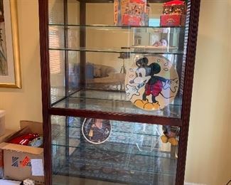 Wood Curio Cabinet w/Interior Lighting & Glass Shelves, 80"H x 47"W x 20"D                                                                                       Walt Disney Collectibles