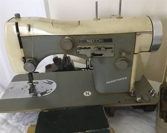Vintage Necchi “Supernova” sewing machine with foot pedal and attachments. 