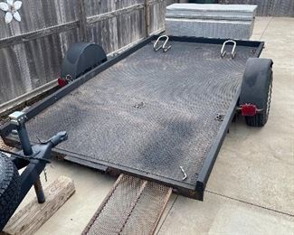 Motorcycle Trailer 
Bullet liner with two bolted in wheel chocks and aluminum diamond plate travel box.
Built in slide in ramps.
143" long (inside frame) x 76" wide (inside frame)
LED Lights with RV Plug and bulldog hitch and jack.
$1,100