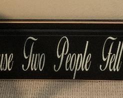 "All Because Two People Fell in Love" sign