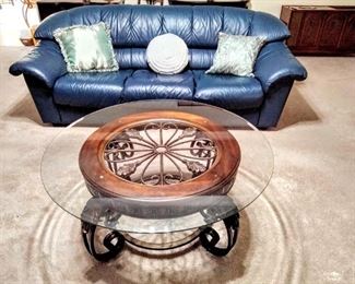 Featuring lovely Blue Leather Sofa & wonderful round scrolled glass-top Coffee Table. 