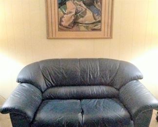 Featuring matching leather Love Seat.
