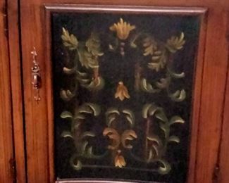Beautiful artistry work on doors of mahogany console.
