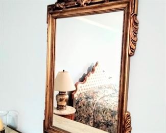 Feature Guilded-Gold leaf matching mirror.