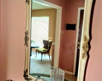 Close-up of lovely Mirror in  solid wood frame & Rose appointments.