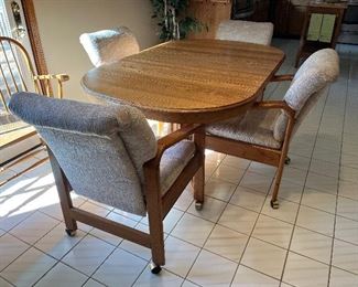 Oak kitchen table with 4 chairs and 4 leafs! Table shown with 1 leaf.....