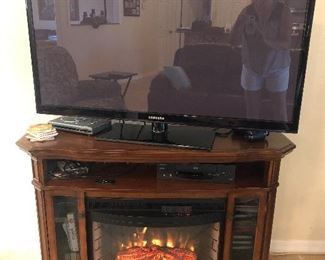 Great fireplace to keep chill out and works as a tv stand. TV also for sale. 