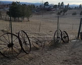 Primitive tools, plows, barbed wire, and one wagon wheel is left.