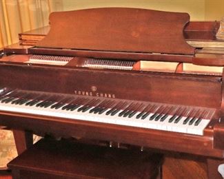 Young Chang Baby Grand Piano with Brown Lacquer Finish. 