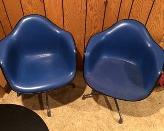 Pair of Herman Miller Eames bucket/molded chairs.