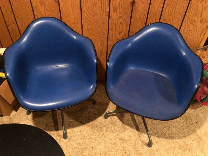 Pair of Herman Miller Eames bucket/molded chairs.