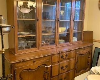 #23	French Provencial China Cabinet w/3 Drawers, 2 doors w/slide out Serving Boards  (top has beveled Glass)  74"Lx 23"Dx24"T  Top 64"Lx14"Dx44"T  (Heavy Wood)	 $275.00 
