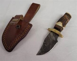 Small Damascus knife and belt loop sheath.