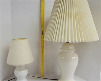 2 White table lamps. 1 smaller.