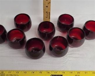 9 Ruby red candle holders.
