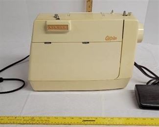 Singer Genie sewing machine with pedal.