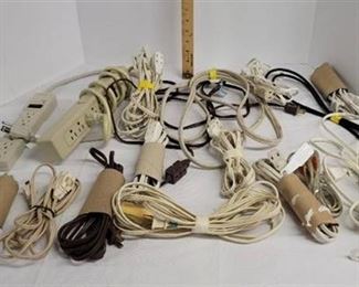 Large lot of small extension cords and power strips.