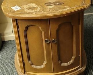 Wooden oval end table. 26" wide 23" tall.