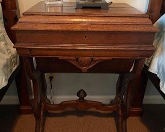 Antique sewing table with storage below and writing surface on top
