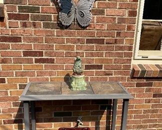 Tile top patio table with glass shelf