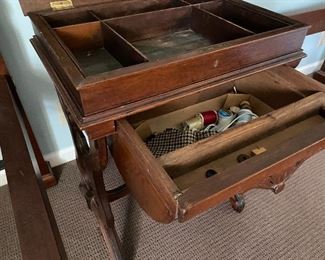 Storage drawer in sewing table 