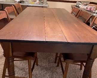 Primitive table. 6 matching chairs. 