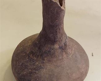 Jar with broken top. Lower part appears to have been repaired.