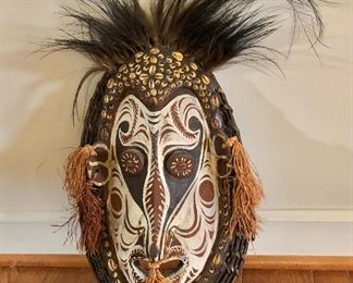 $425  Wood cowrie painted  mask #2.  17" H, 11" W, 4" D.