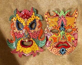 $100.  Pair of colorful masks.   Each 10" H x 8" W. 