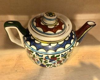 $25  Ceramic  tea pitcher  6" H, 11" W, 7" D. 