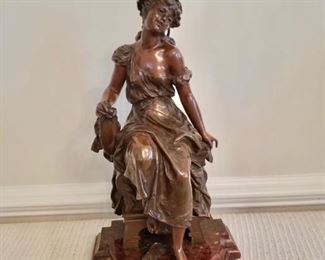 $750 - Metal female figure on marble stand  19" H, 10" W, 8" D. 