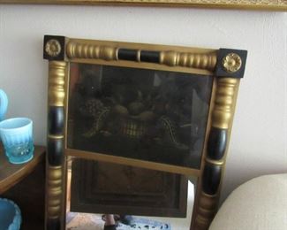 Beautiful antique mirror with reverse painted image.