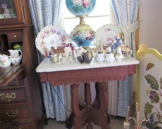 Marble top antique table and Gone With the Wind lamp.