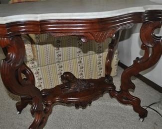 Beautiful marble top table with carved dog