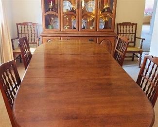 Ethan Allen perfect condition dining room set.  When fully open table measures 44x102 and fits 10-12 people.  2 leafs for table with protective table pads.  Display hutch on top with light and bottom storage cabinet. 6 chairs (4 chairs + 2 arm chairs). Top quality.  Moving sale.  $500.