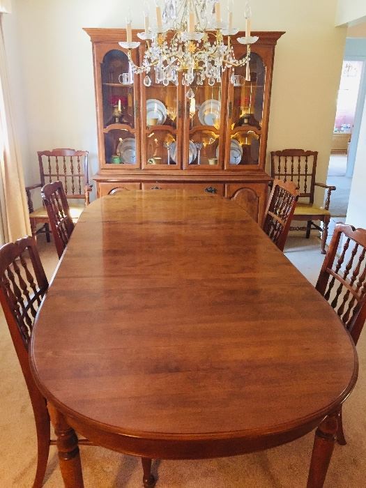 Ethan Allen perfect condition dining room set.  When fully open table measures 44x102 and fits 10-12 people.  2 leafs for table with protective table pads.  Display hutch on top with light and bottom storage cabinet. 6 chairs (4 chairs + 2 arm chairs). Top quality.  Moving sale.  $500.