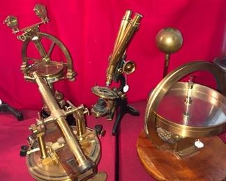 Antique brass scientific measuring instruments of all sorts! In foreground left Lorieux Paris, telescope theodolite instrument. Background left instrument by E. T. Newton & Son. Binocular "Challange" microscope by Swift & Son, London. 