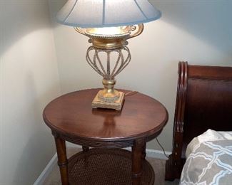 Two-tier round table with burnished gold lamp