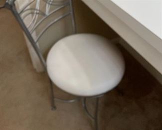 Metal chair with vinyl seat covering