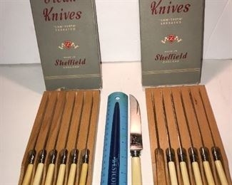 2 sets of steak knives with an oatmeal color Bakelite 