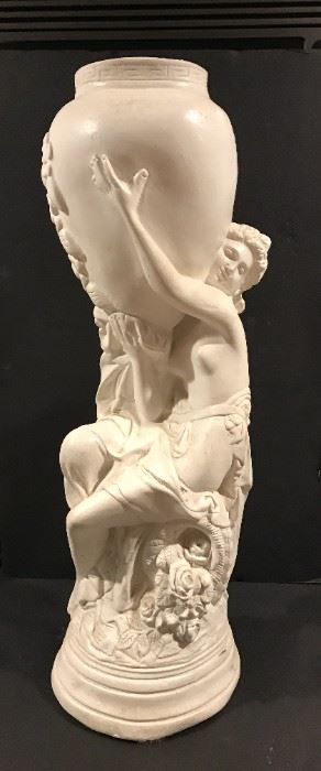 Tall figural nymph holding urn