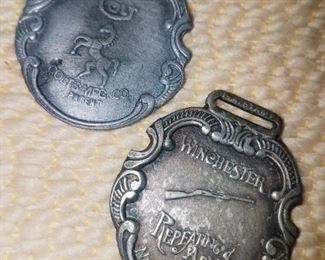 Vintage Colt and Winchester watch fobs 