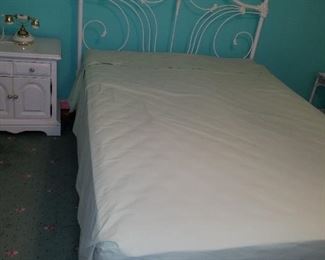 queen bed with metal headboard