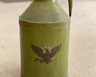 Vintage green metal jug with eagle design. Measures 17" H x 8.5" W.