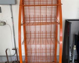 Vintage metal storage rack on wheels. Measures 55" H x 26" W x 17" D. 