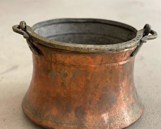 Antique copper pot with brass handle. 