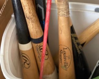Assorted sports equipment -- bats, hockey sticks, etc. Photo 1 of 2. 