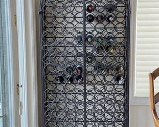 Metal wine rack.  Measures 36.5" W x 18" D x 81.5" H. 