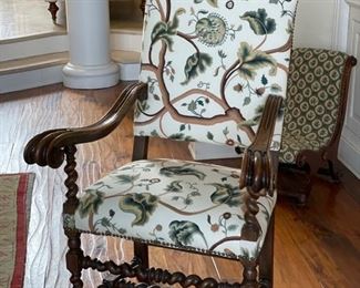 Pair of Jacobean-style carved wood armchairs with barely twist frame with nailhead trim. Crewel embroidery fabric. Measures 50" H. Seat depth 18"  and arm height 29". Photo 1 of 3. 